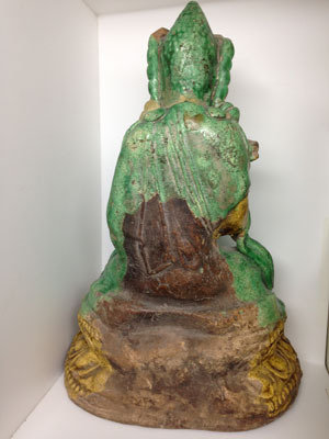 A Ming glazed stoneware figure of a Seated Boddhisattva  view one